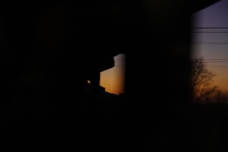 Evening shot of solar panels silhouetted against a fading sunset, highlighting their structure