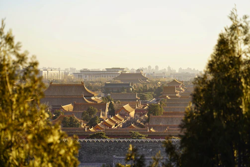A panoramic view of a Chinese ancient architectural site illuminated at dusk.