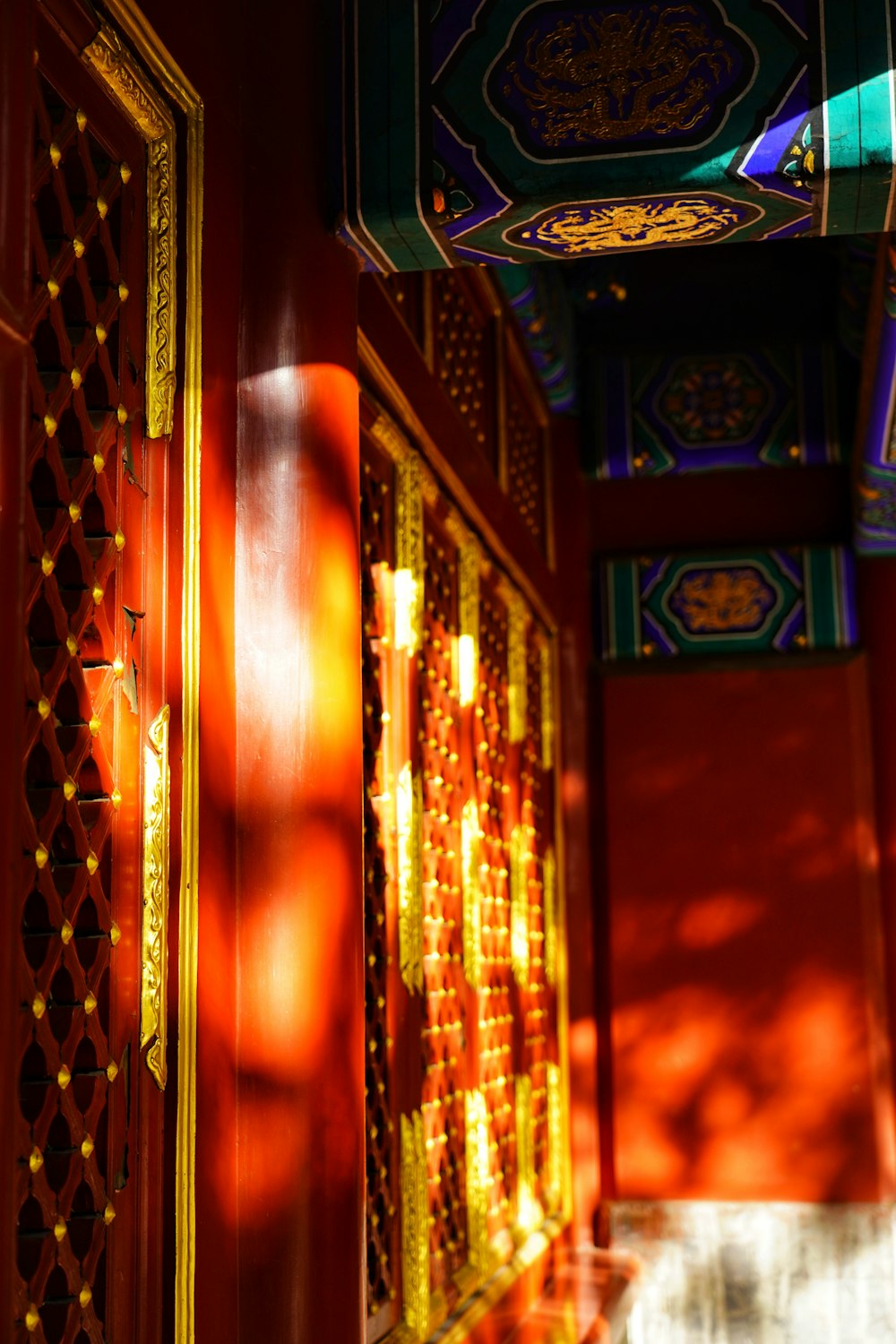 a hallway in a building with a red wall