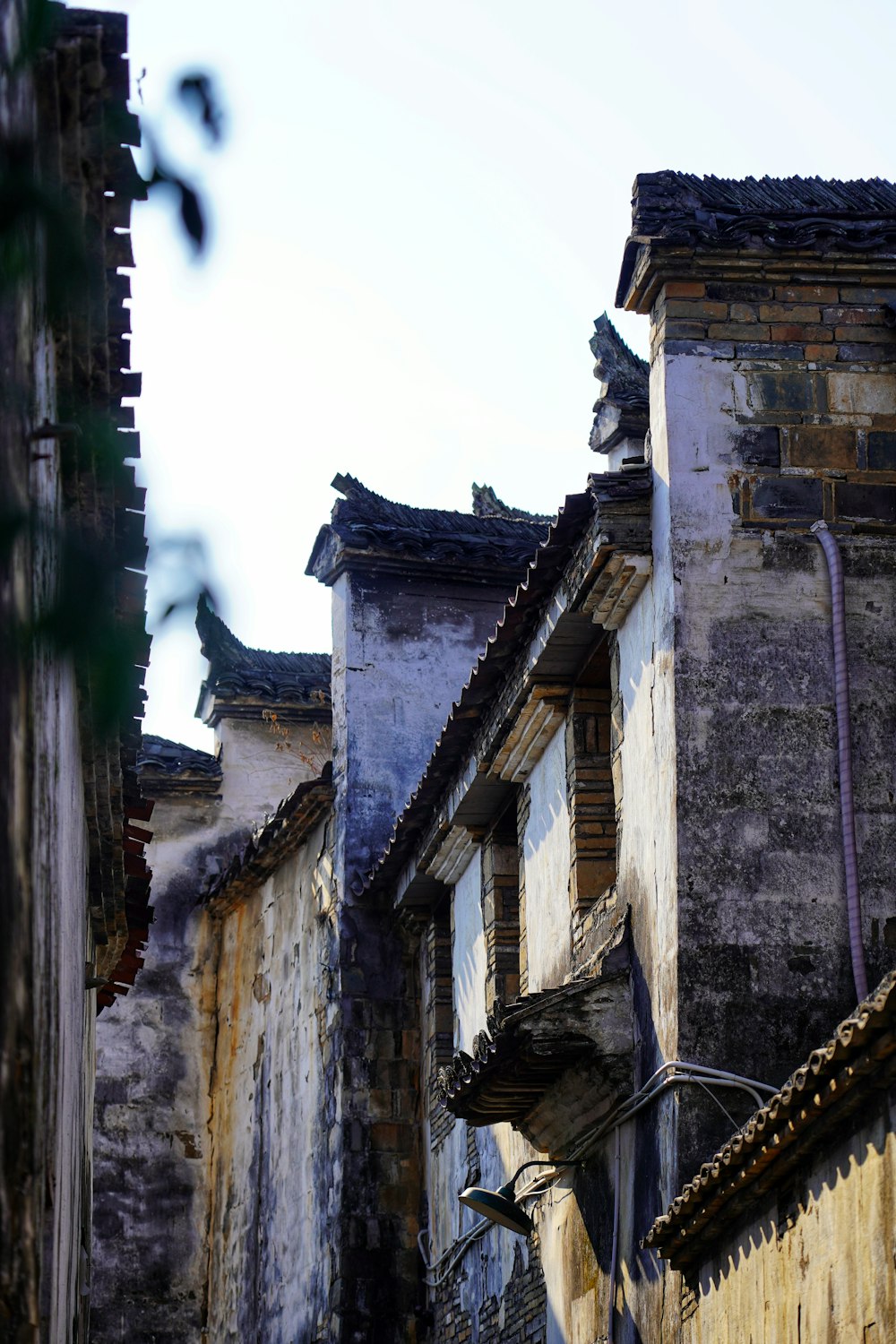 an old building with a clock on the side of it