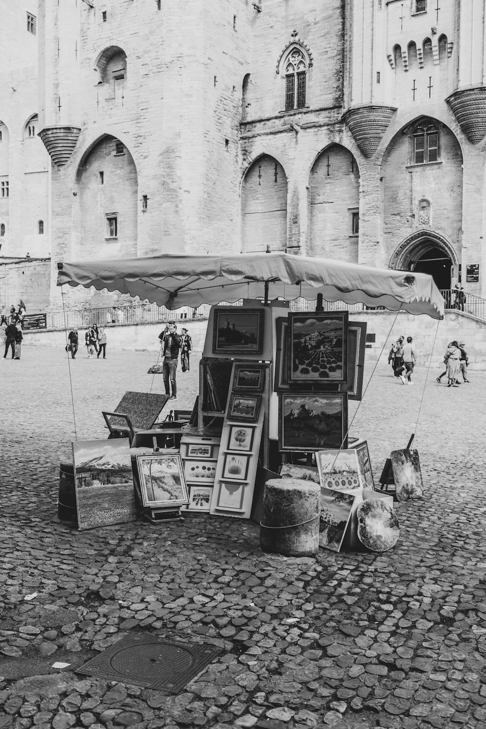 a black and white photo of a street vendor