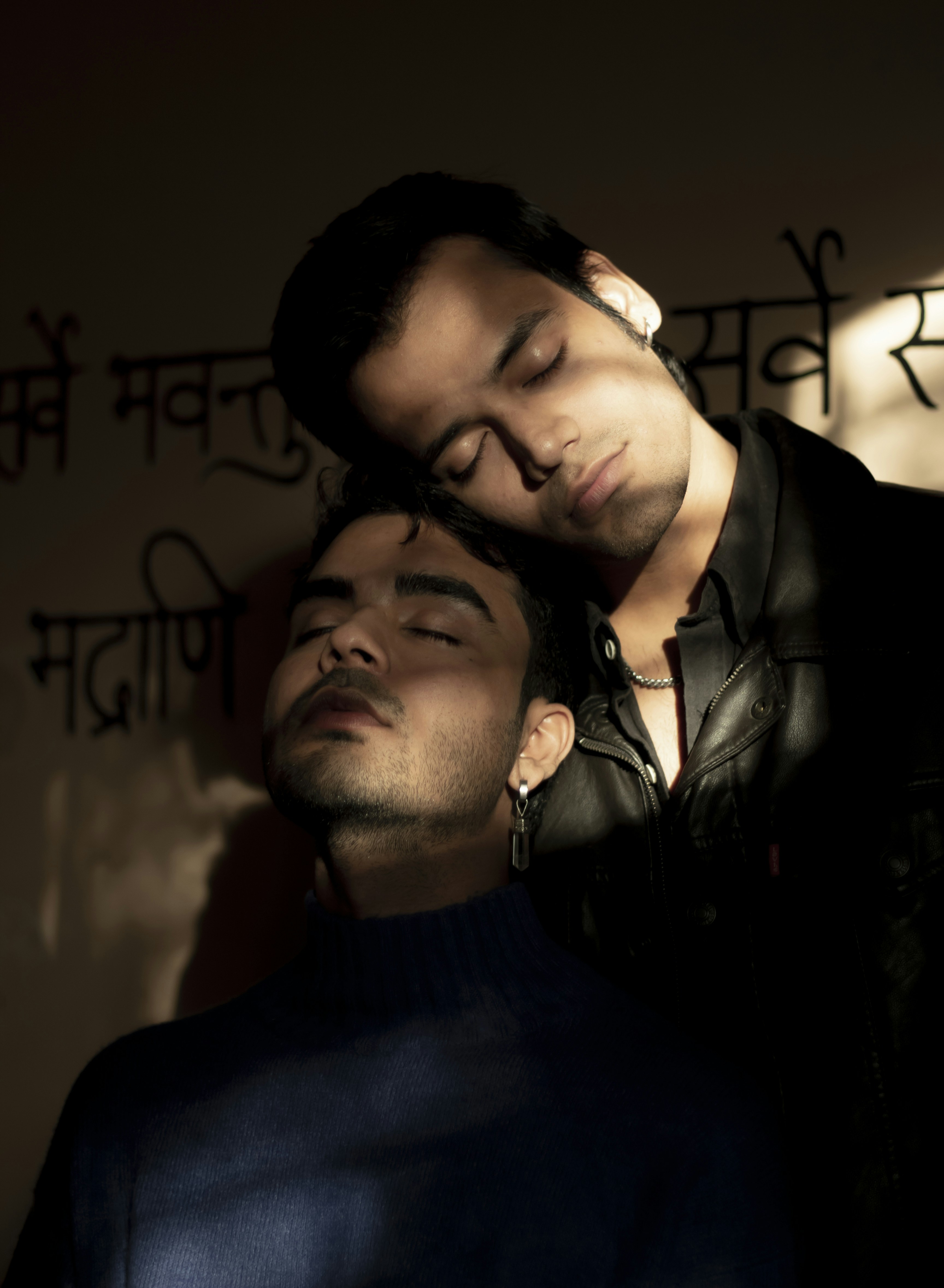 a couple of men standing next to each other