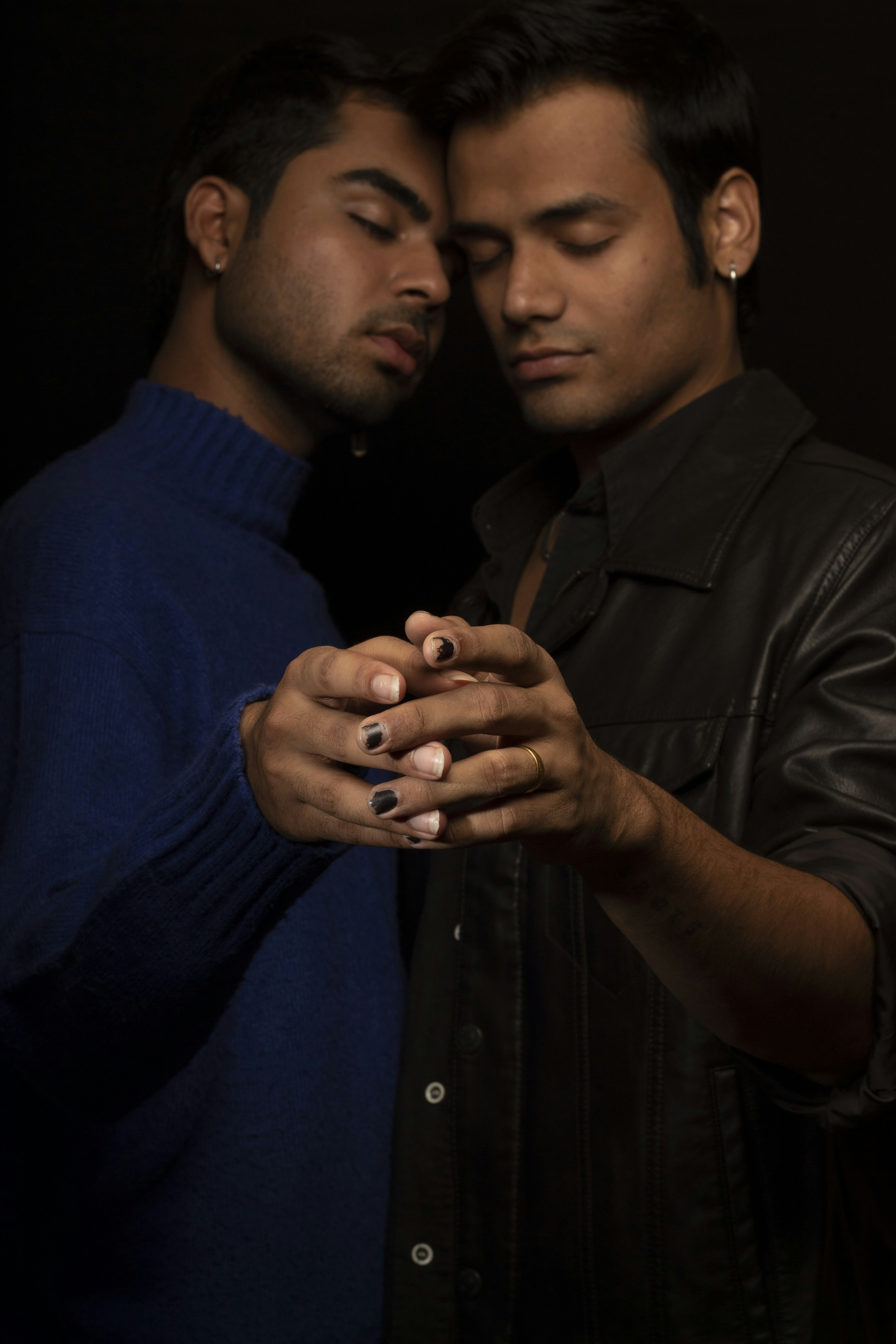 a couple of men standing next to each other