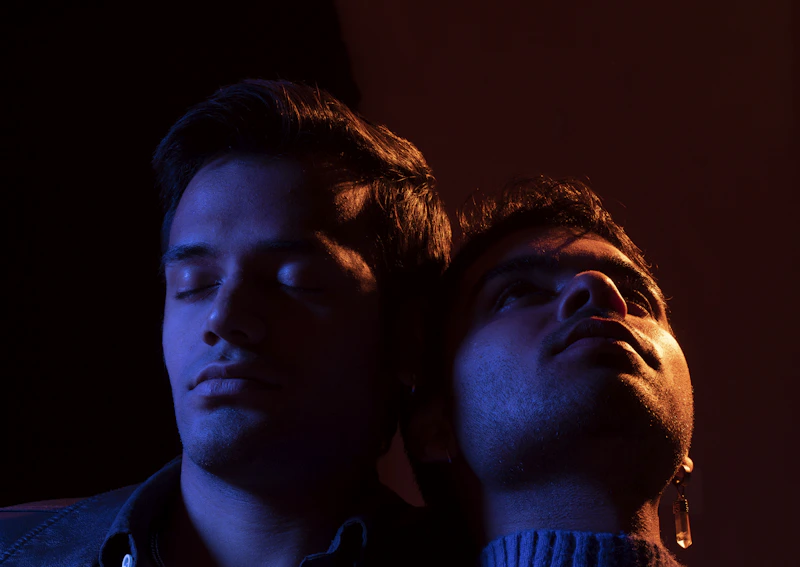 male couple standing side by side