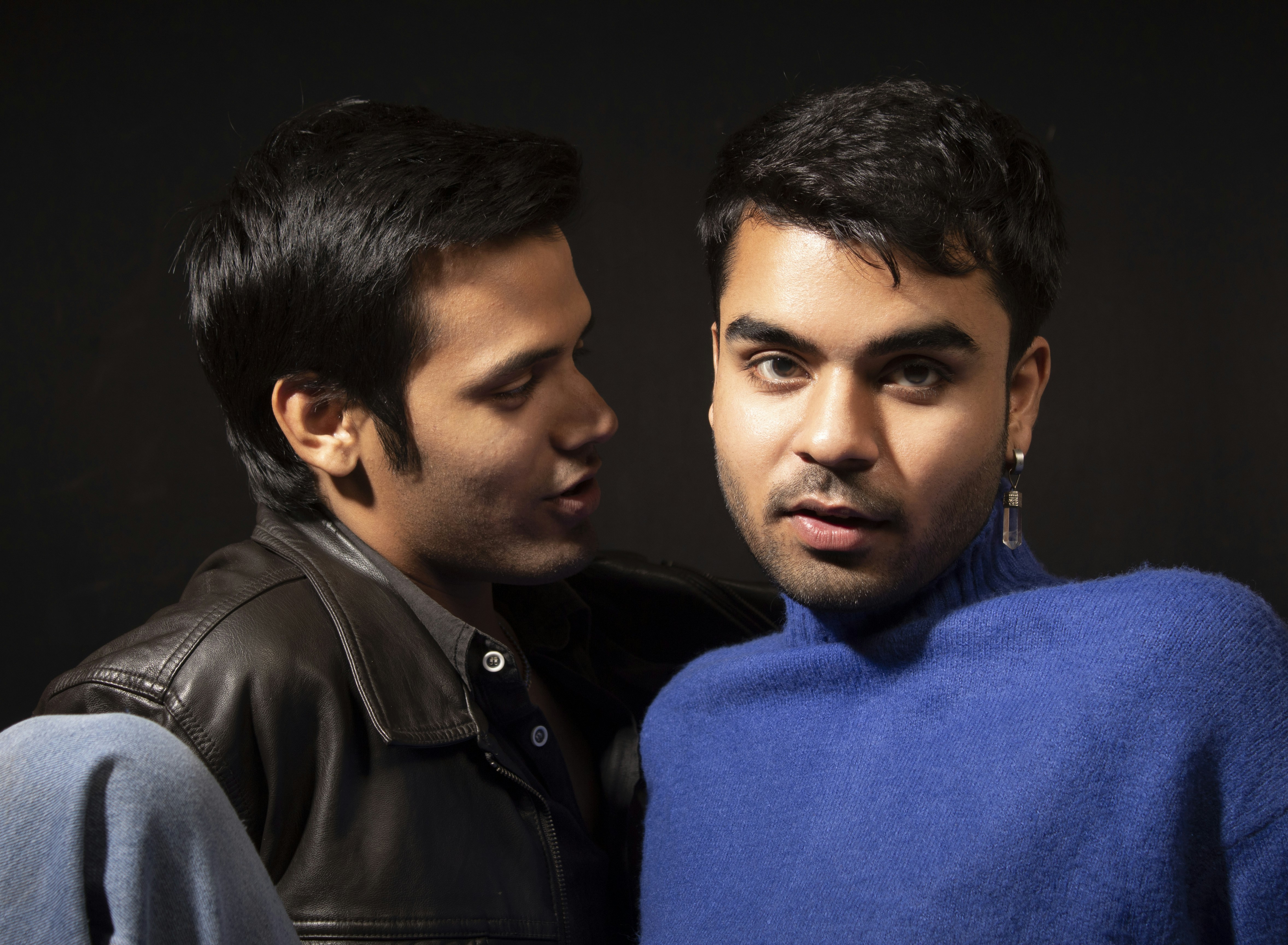 a couple of men standing next to each other