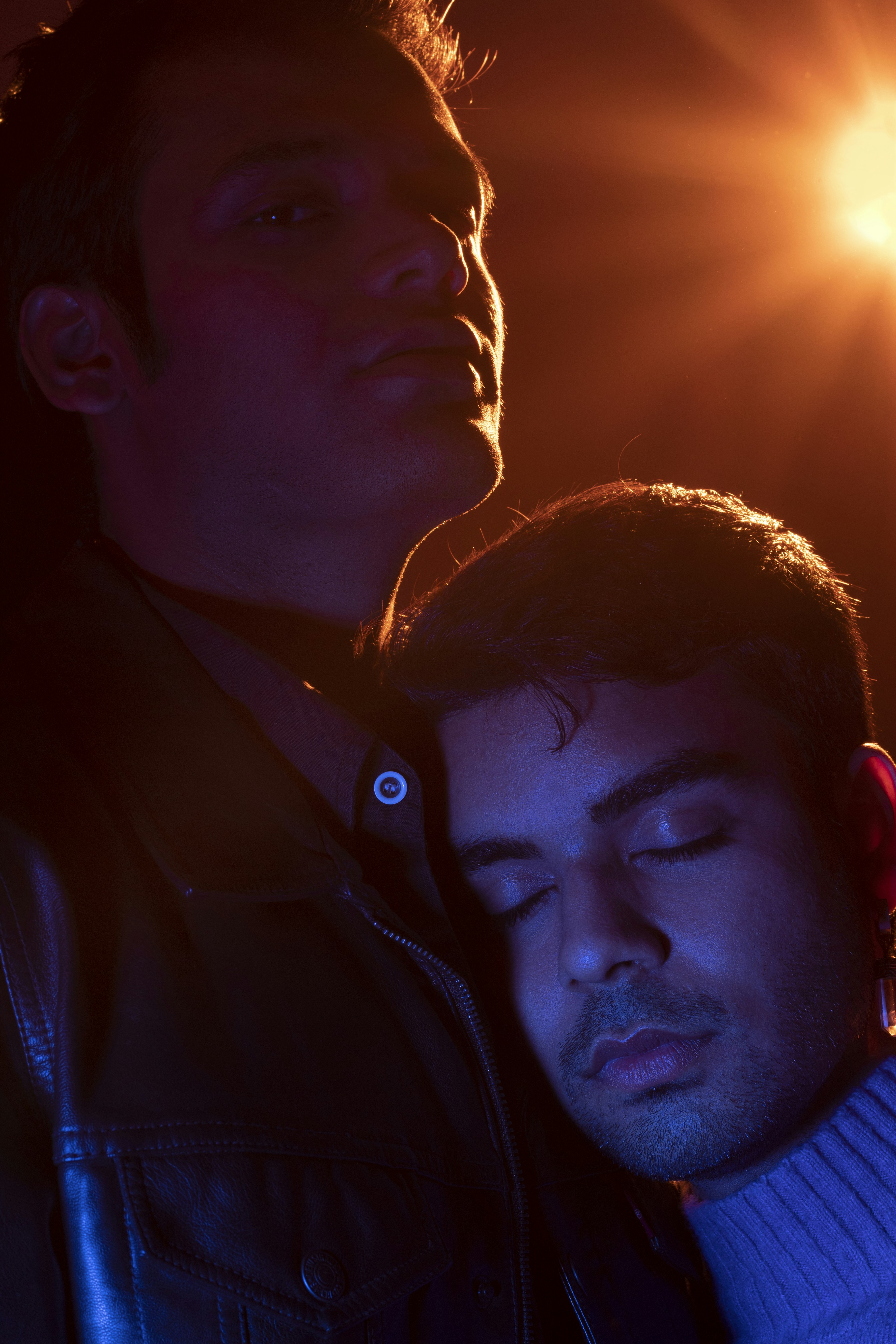 a couple of men standing next to each other