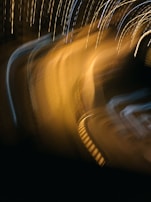 Abstract artistic frame showing light trails in dark blue and bright yellow hues.