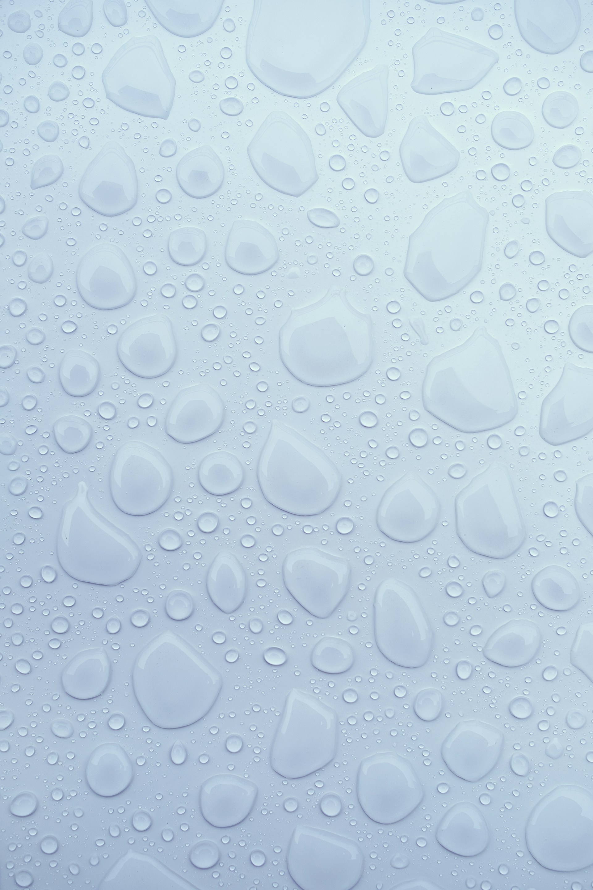 drops of water on a white surface