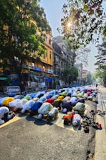 a group of people laying on the side of a road