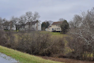 Realistic image of a modern urban and rural property landscape without visible people.