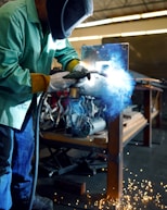 a welder working on a piece of metal