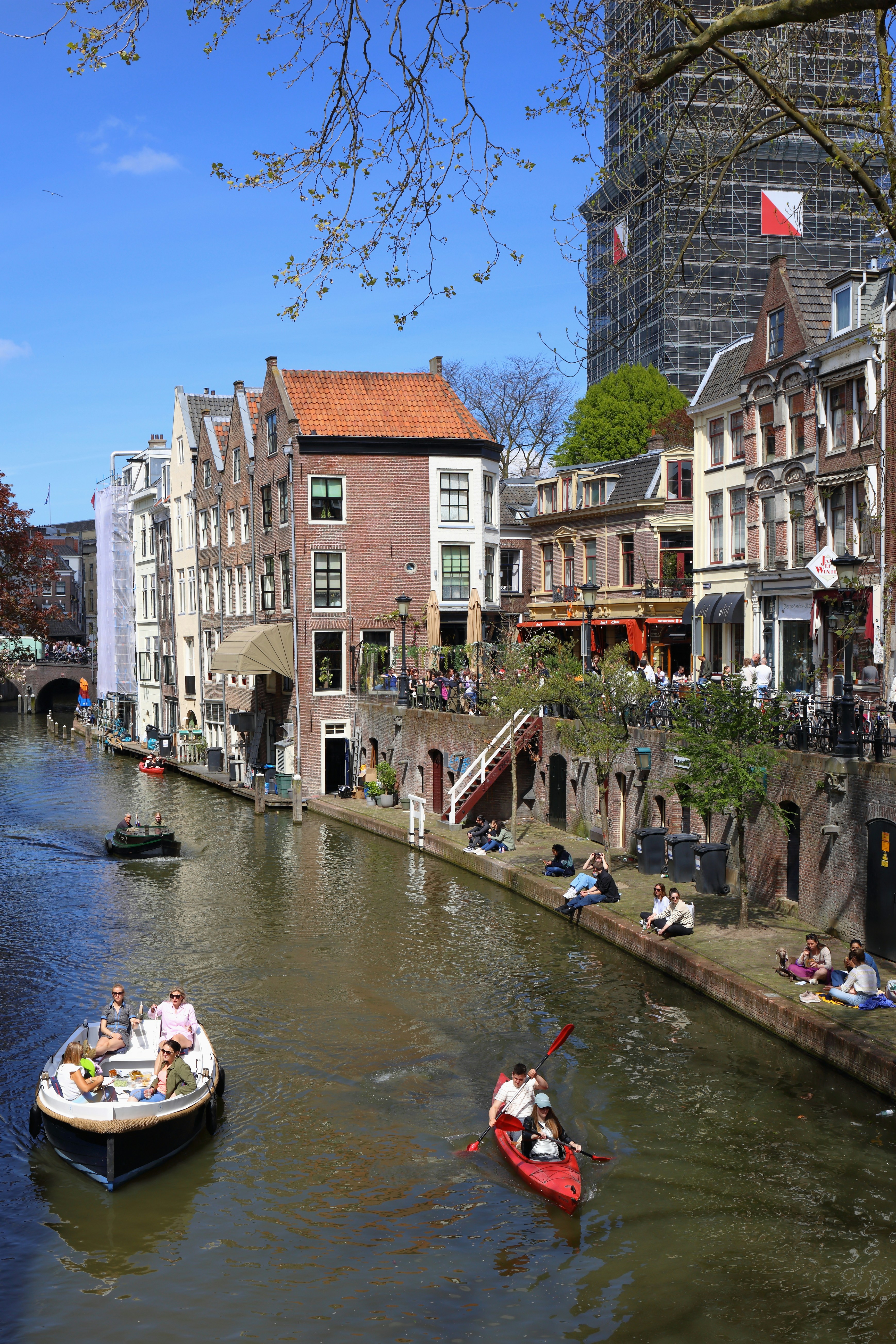 a river running through a city next to tall buildings