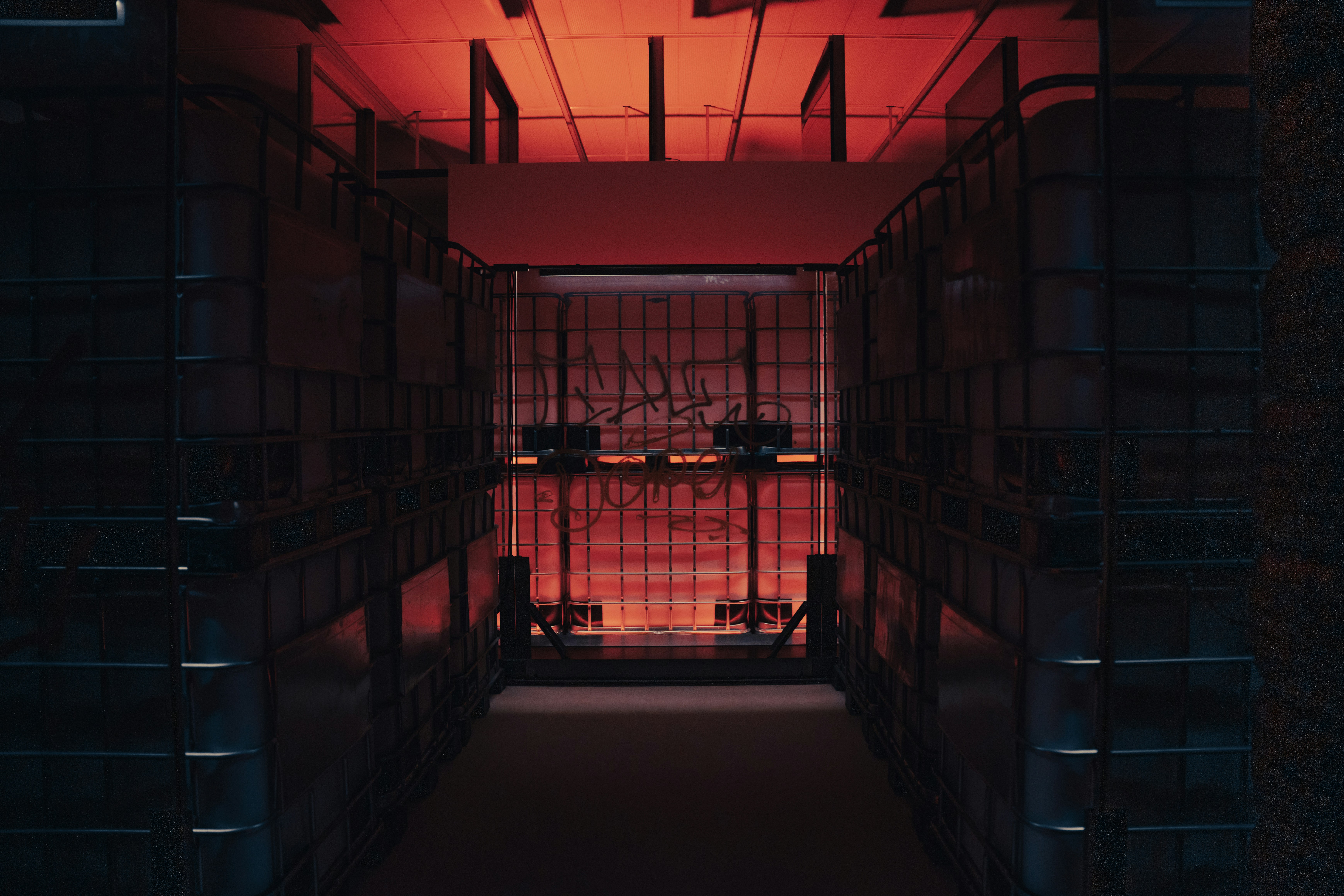 a dimly lit hallway with a red light, 