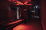 A sleek industrial warehouse interior with advanced logistics equipment under moody lighting.