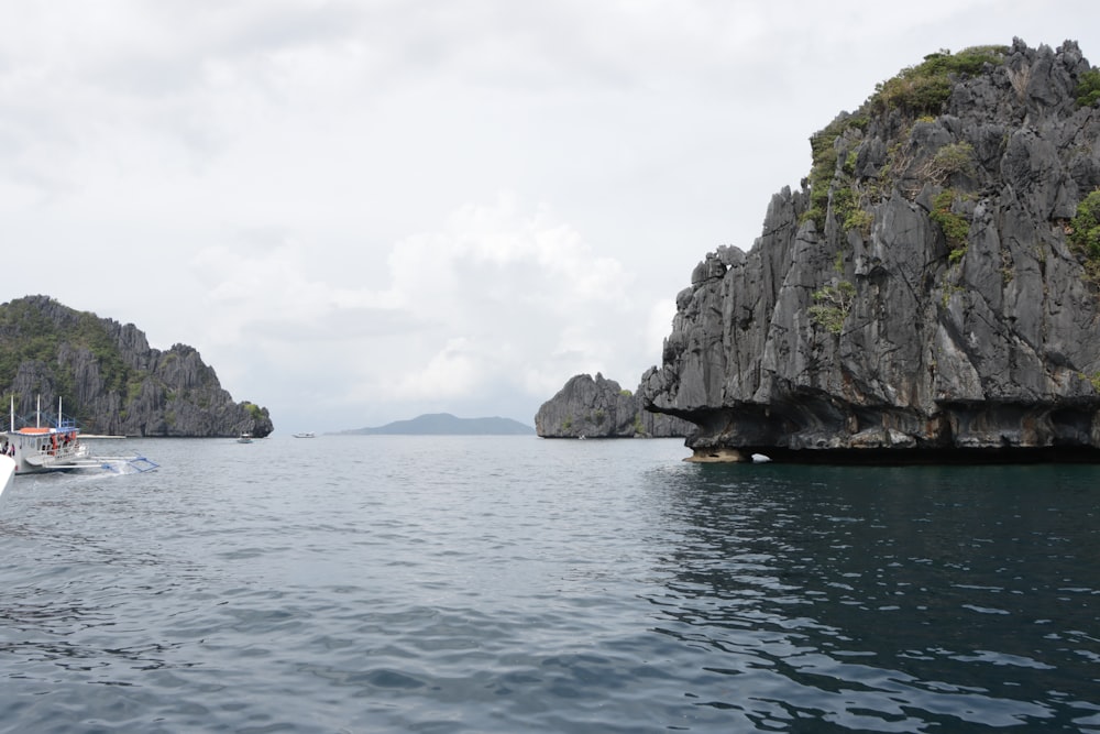 a group of boats floating on top of a large body of water