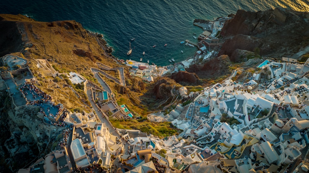 an aerial view of a city next to the ocean