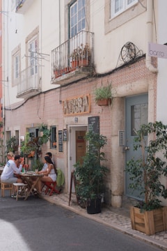 Cozy café terrace with people chatting and enjoying coffee in Reus