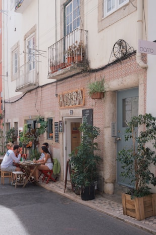 A cozy café terrace with people enjoying traditional Mexican coffee.