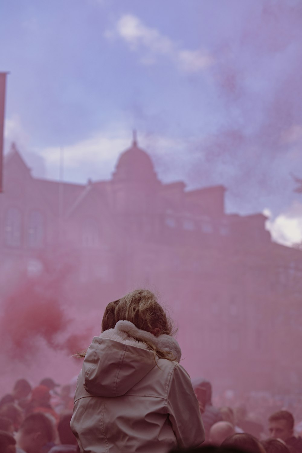 a woman standing in front of a crowd of people