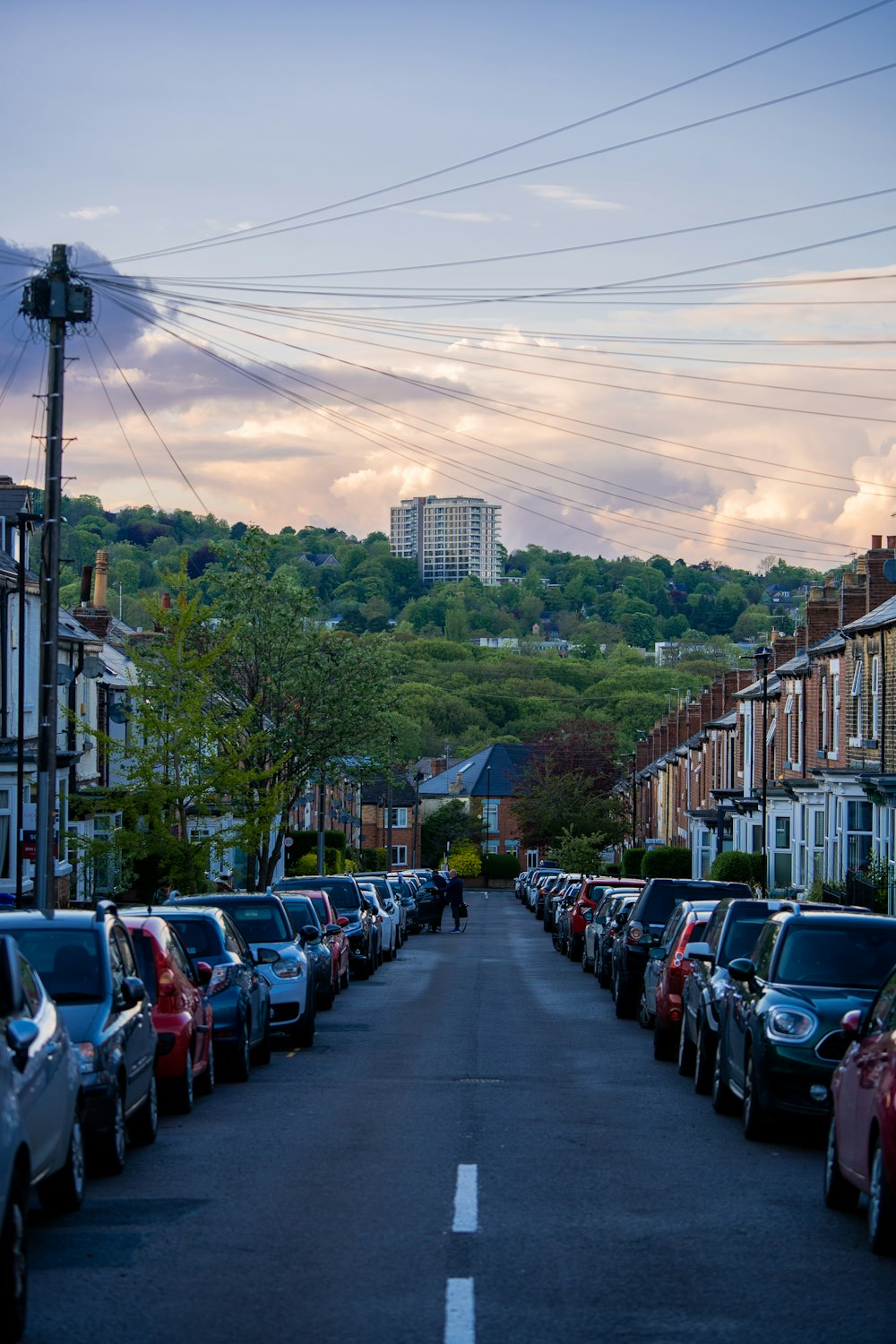 a row of parked cars on a city street