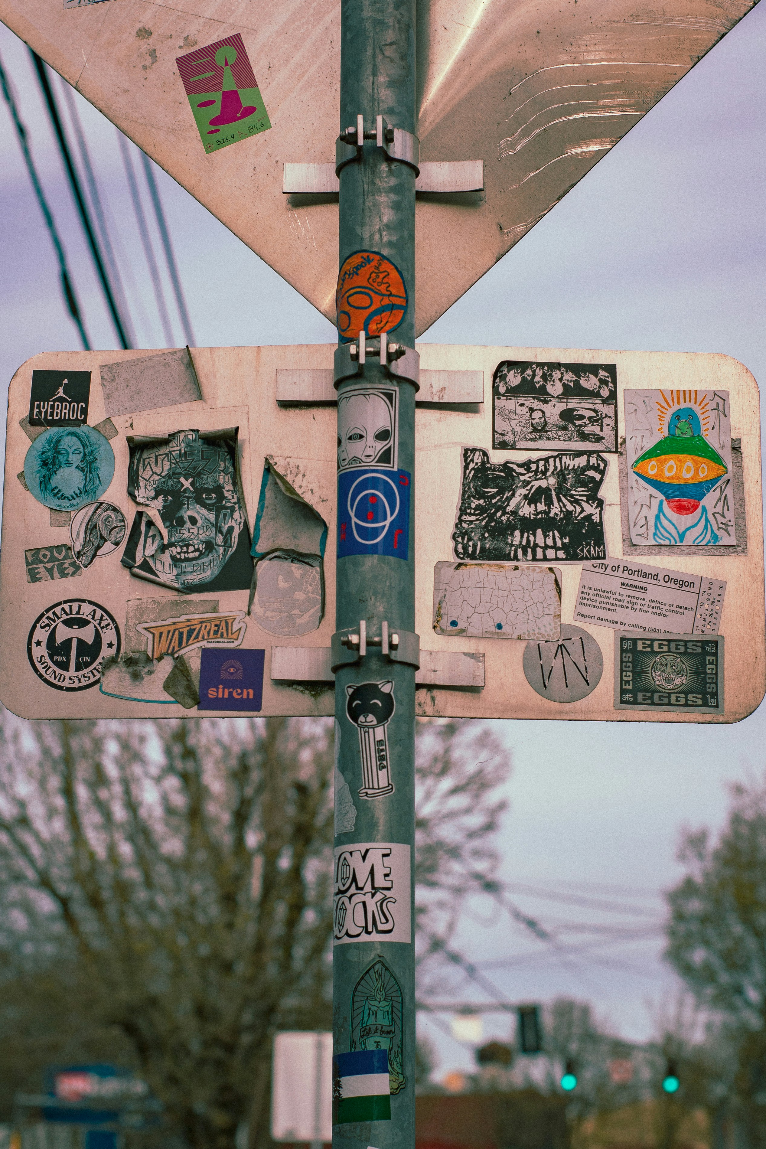 A close up of a street sign with a lot of stickers on it photo – Free ...