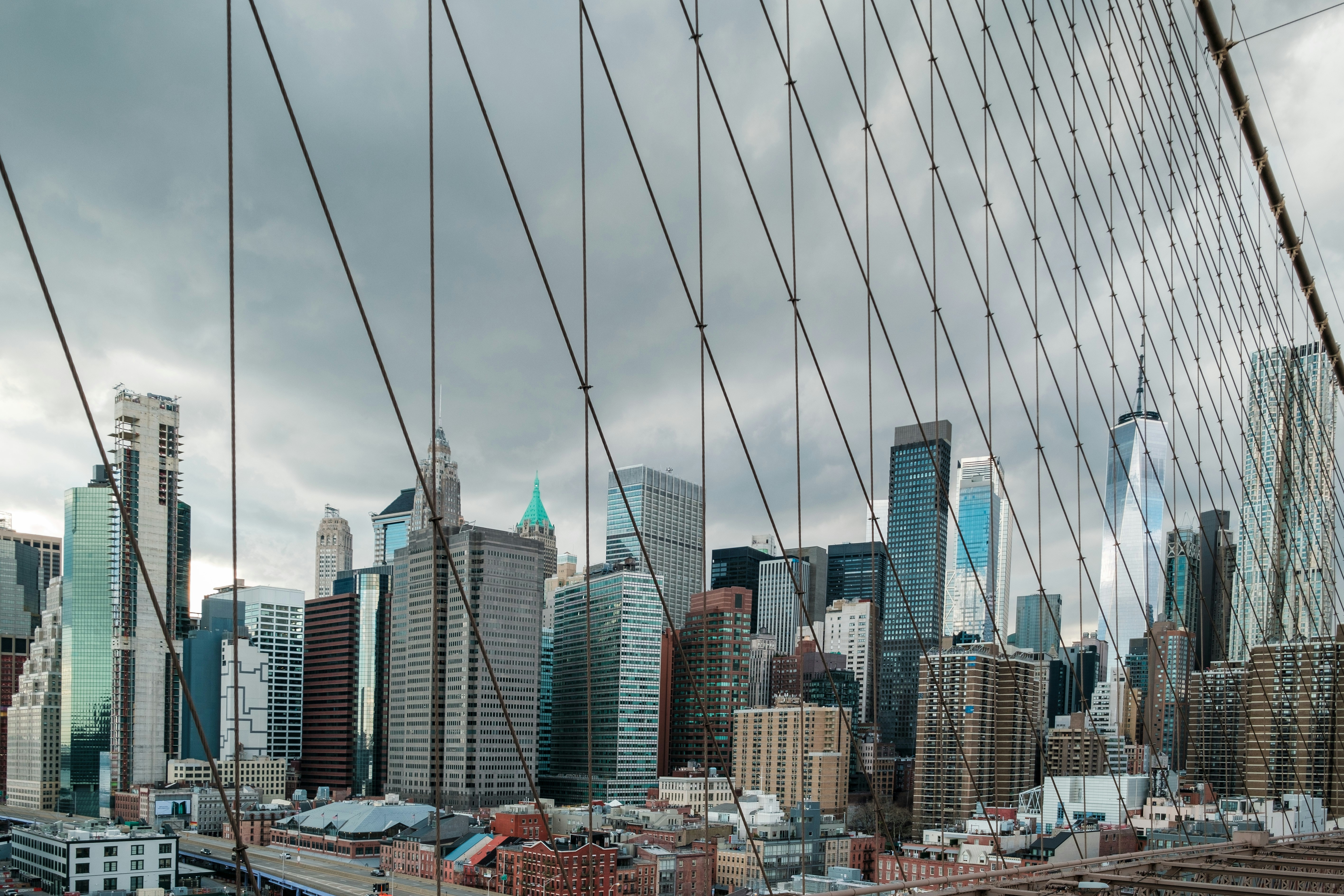 a view of a city from the top of a bridge