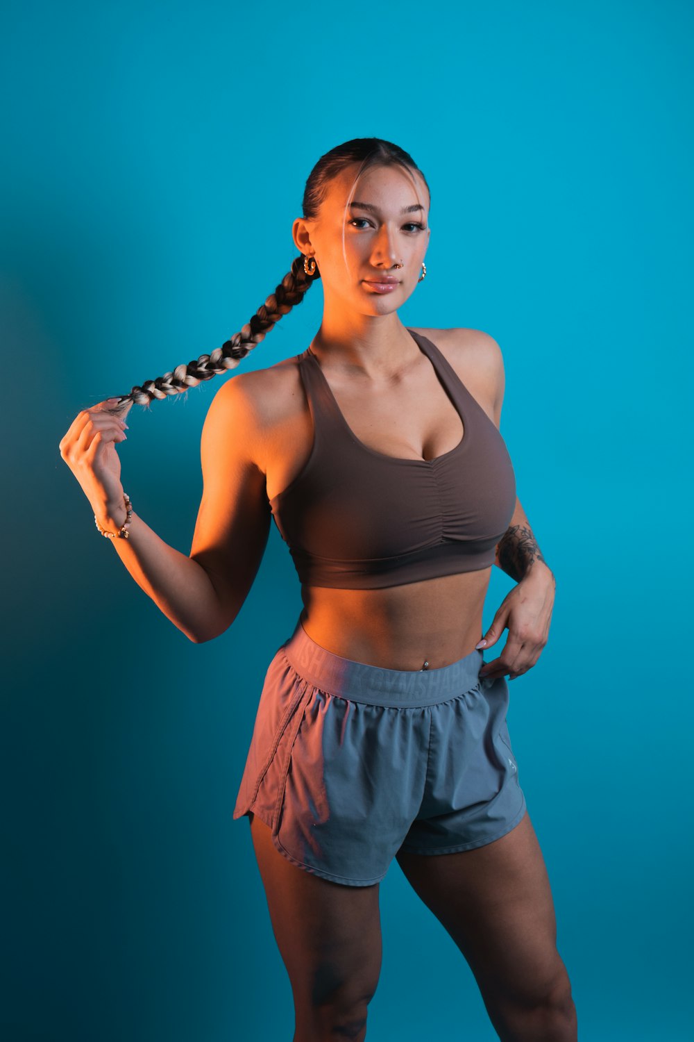 a woman in a sports bra top posing for a picture