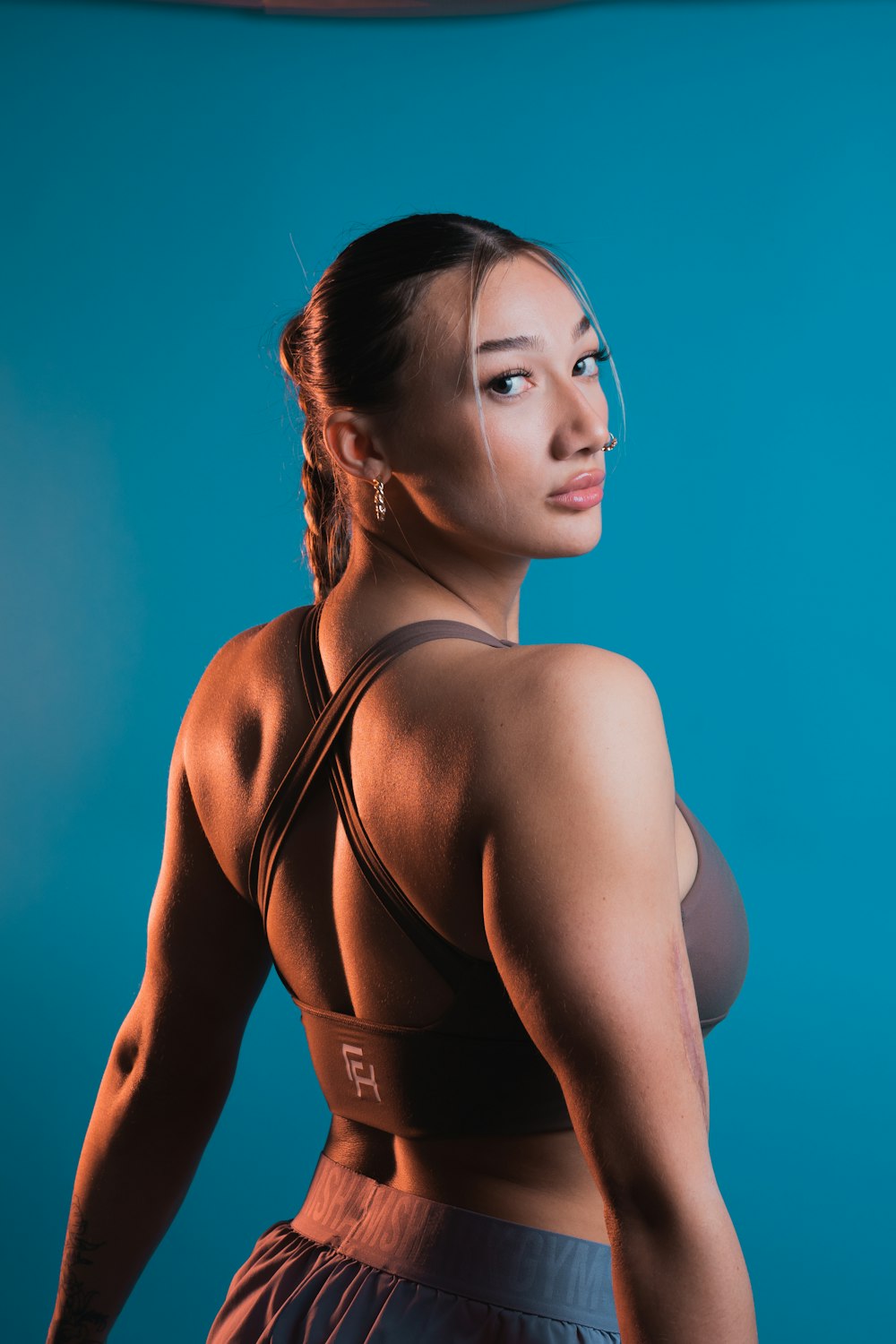 a woman in a sports bra posing for a picture