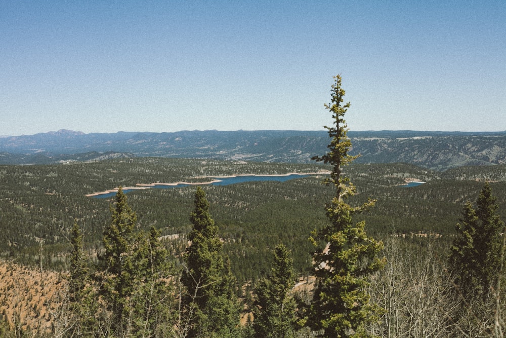 a view of a mountain range with a lake in the distance