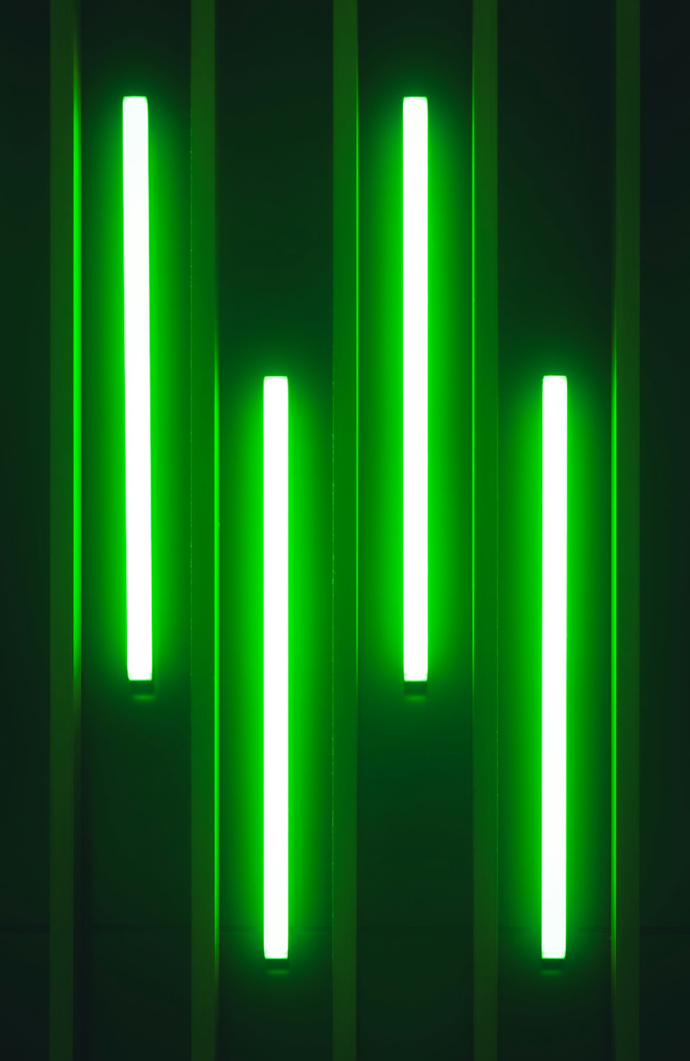 a group of green lights that are on a wall