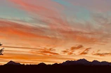 Sunset over the Andes mountains with colorful clouds.