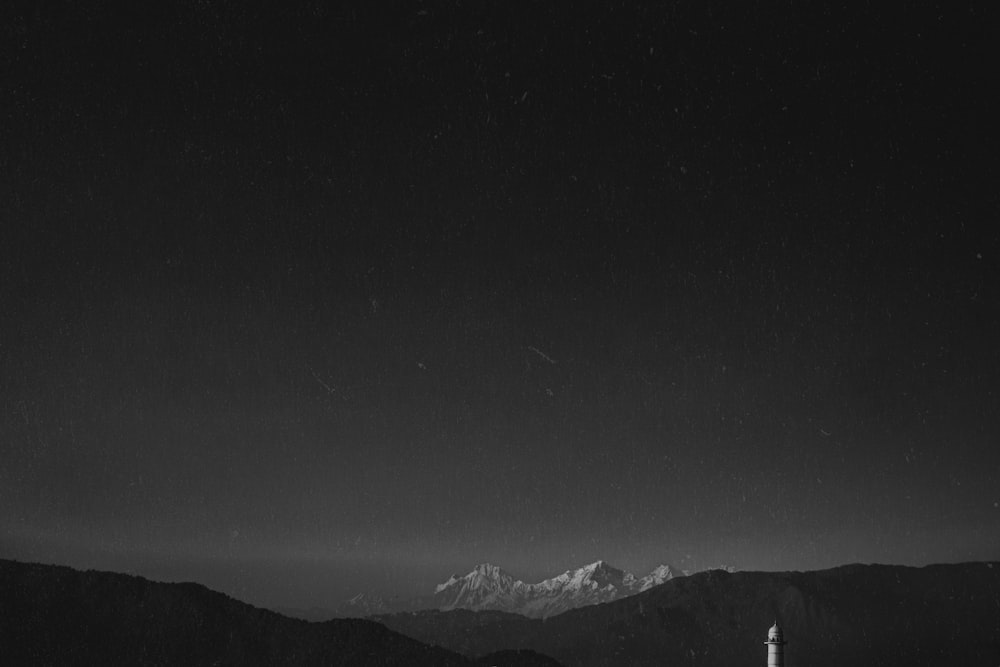 a black and white photo of a mountain range