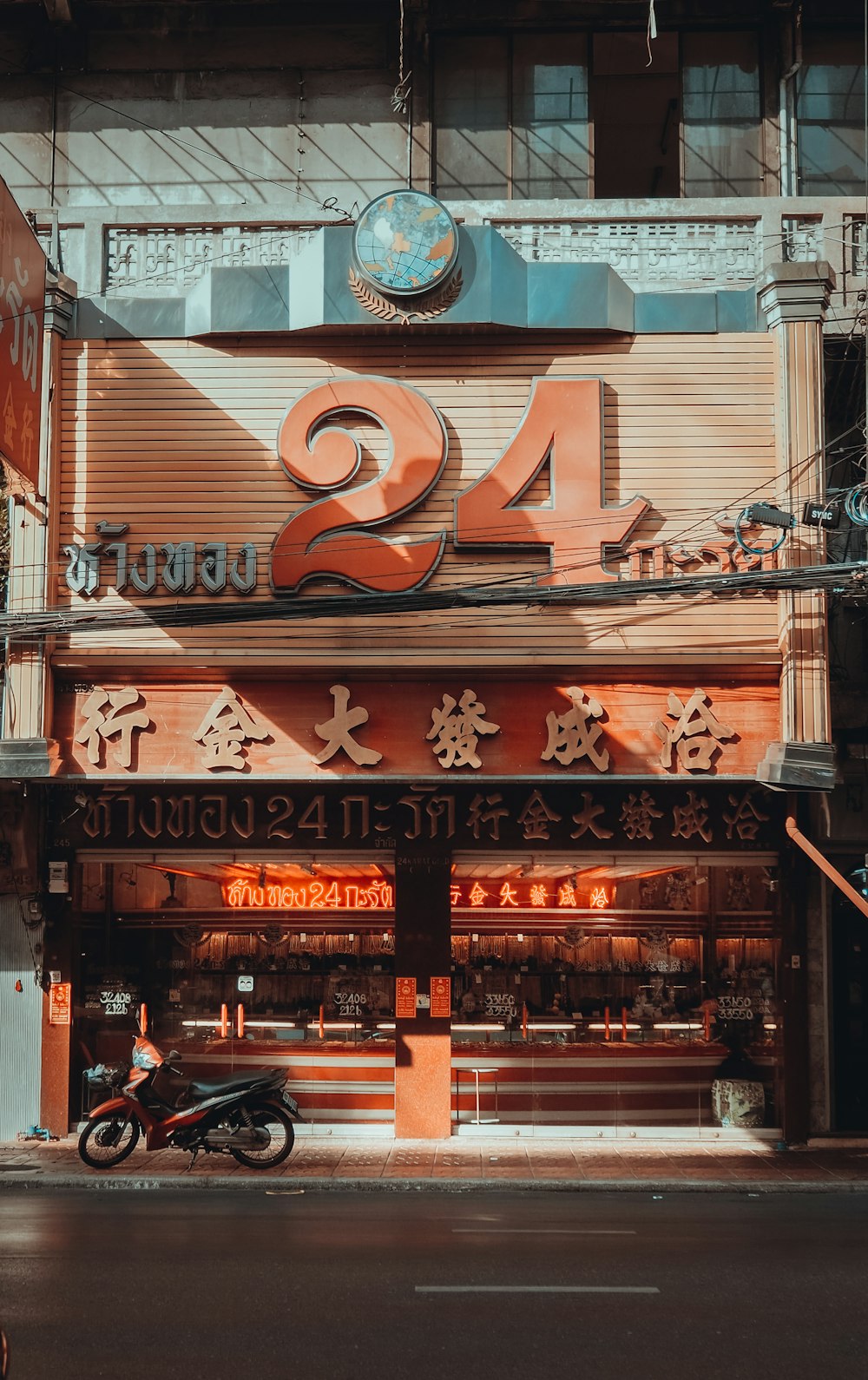 a motorcycle parked in front of a chinese restaurant