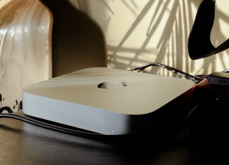 a computer mouse sitting on top of a wooden table