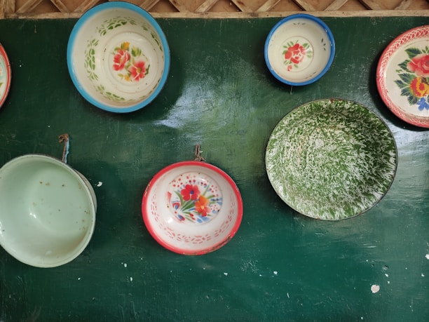 An elegant set of colorful bowls arranged on a wooden table, showcasing their vibrant patterns.