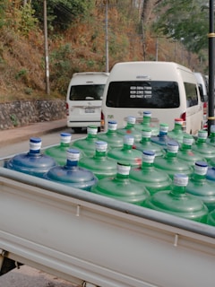 A delivery truck loaded with Boss Water cases, ready to supply retailers consistently.