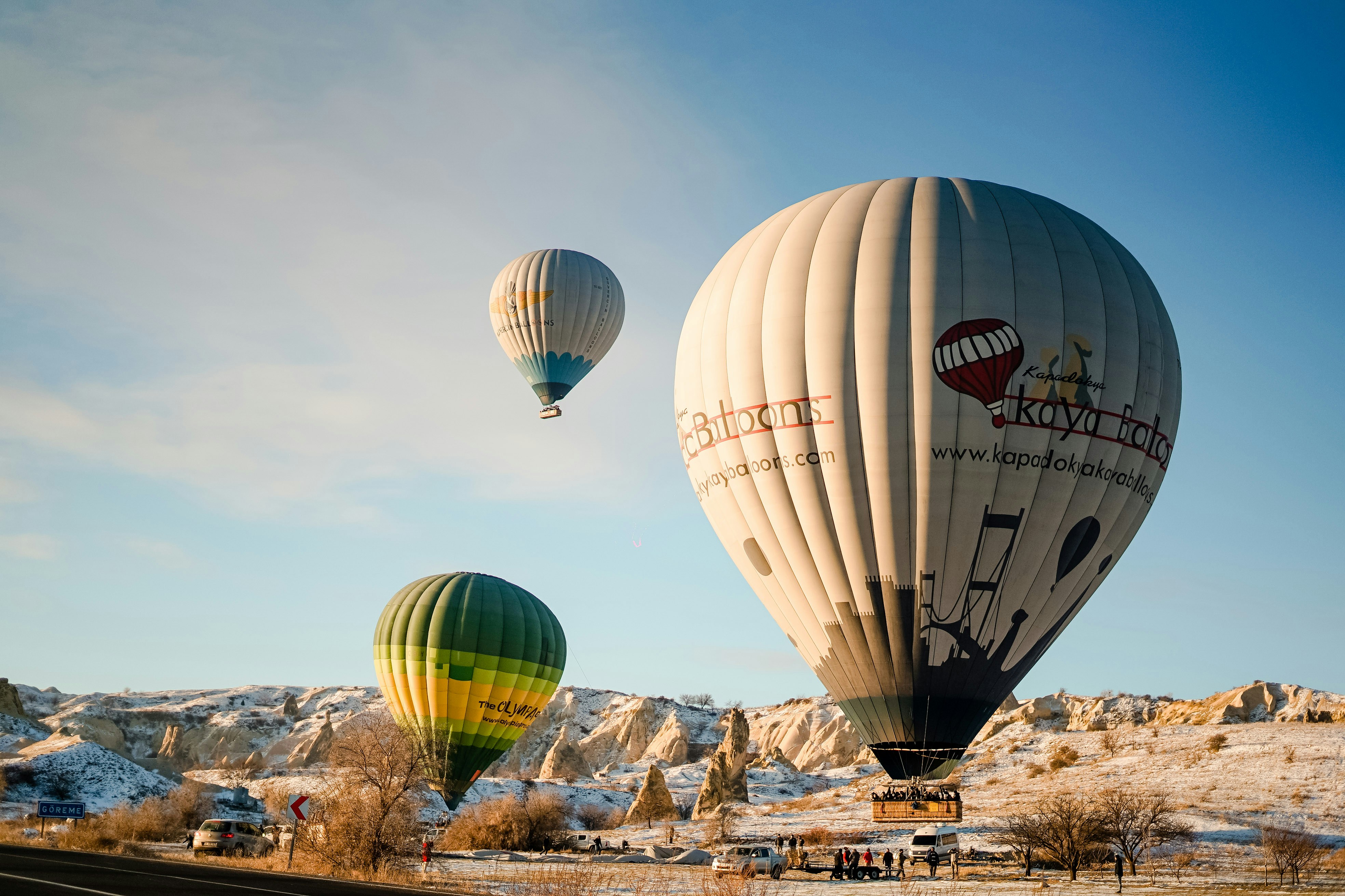 a couple of hot air balloons flying in the sky