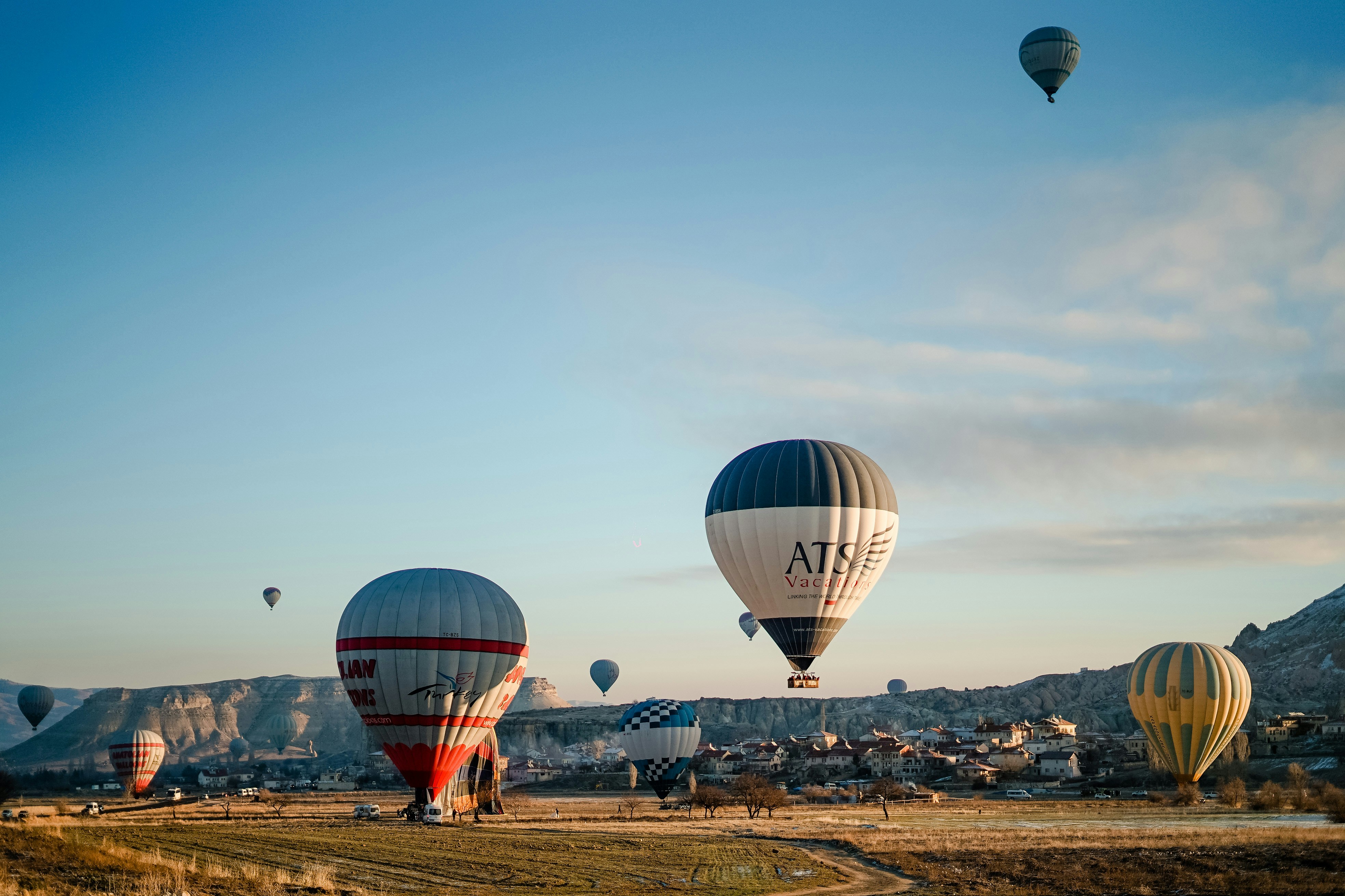 a number of hot air balloons flying in the sky