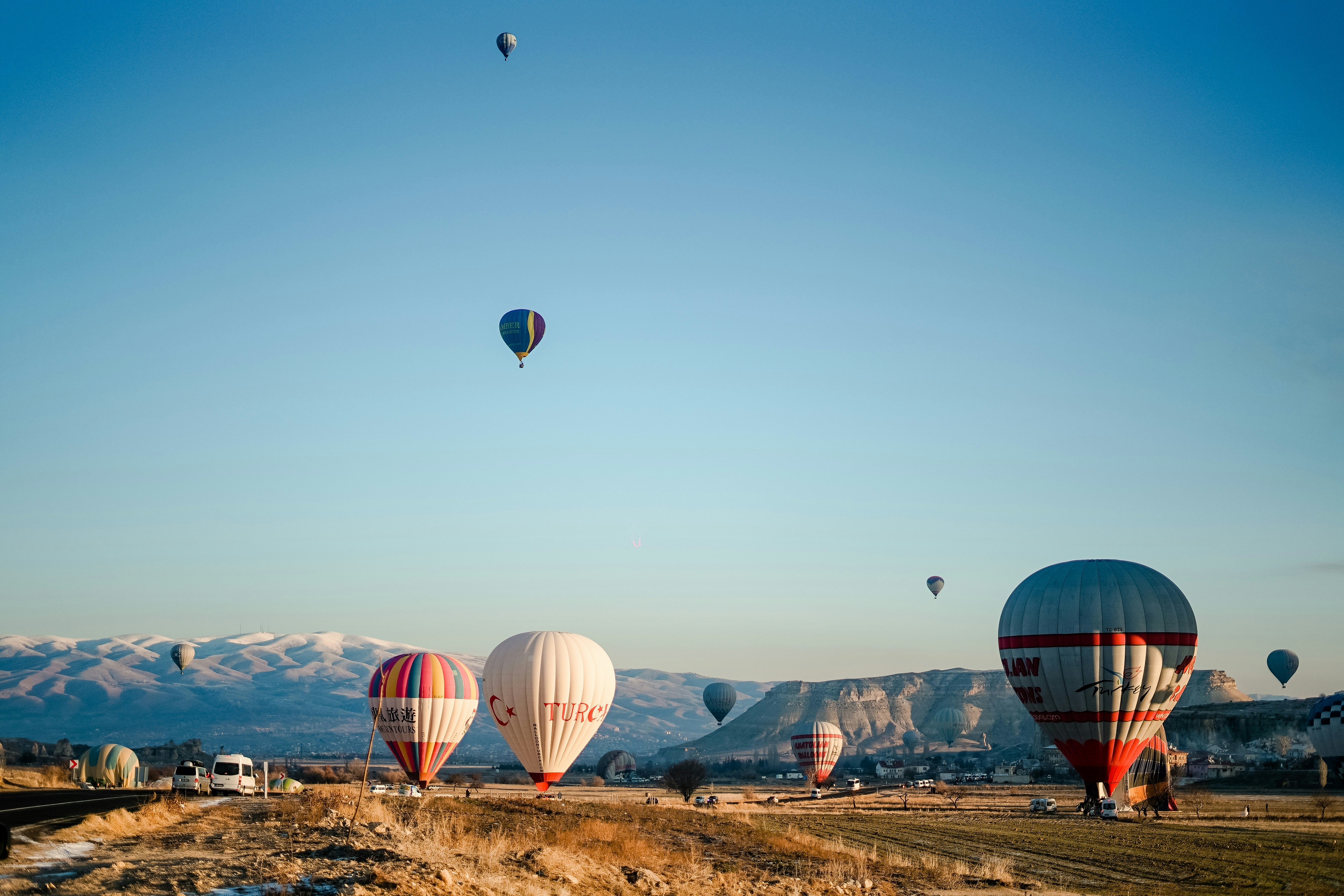 a bunch of hot air balloons flying in the sky