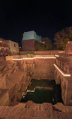 Intricate carvings on the historic stepwell in Gujarat glowing in warm sunlight.