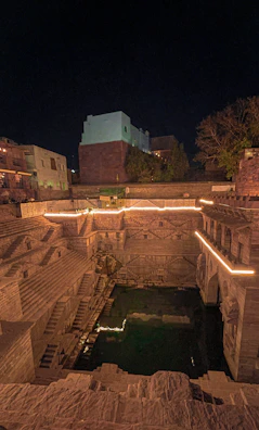 Intricate carvings on the historic stepwell in Gujarat glowing in warm sunlight.