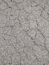 a close up of a cracked asphalt surface