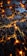 A digital circuit-like pattern with interconnected glowing orange lines and black polygonal shapes conveying a futuristic and technological theme.