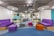 A modern office space with stylish decor and a vibrant color palette.