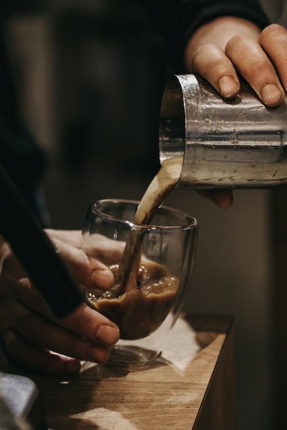 A person pours coffee into a glass photo – Free Making coffee Image on  Unsplash
