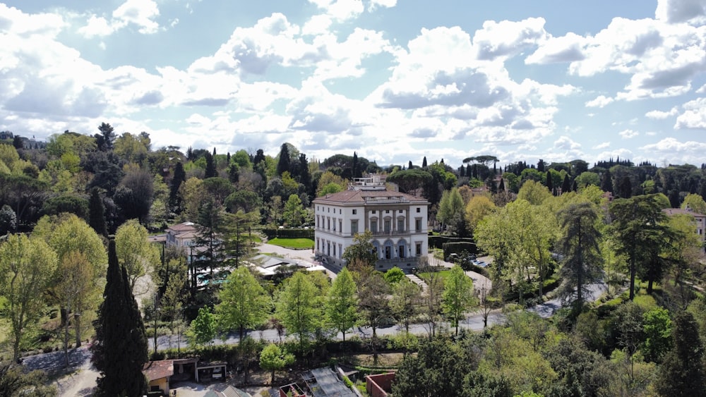 an aerial view of a building surrounded by trees