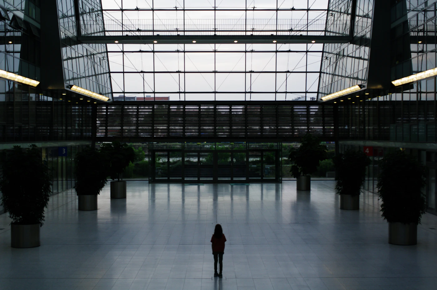 A person standing alone in a large open space