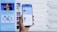 A hand holding a smartphone displaying a news website, with a blurred large computer screen in the background also showing similar content. The webpage on the phone features articles with images and text.