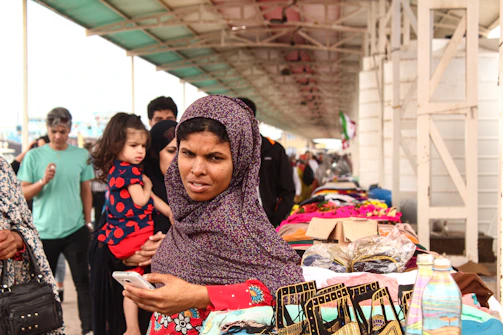 A traveler using a smartphone app to explore a vibrant local market.