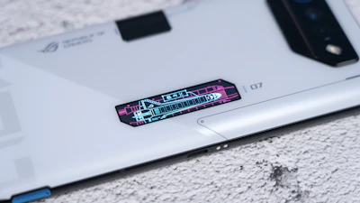 A sleek smartphone displaying a multi-language IVR menu with Nigerian currency symbols.